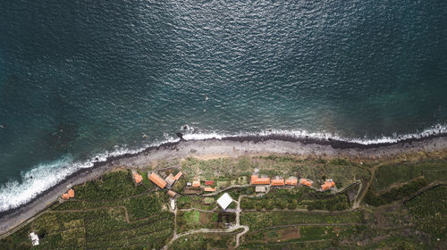 Aerial view of seascape by town