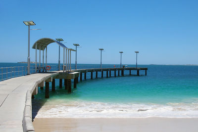 View of beach against blue sky