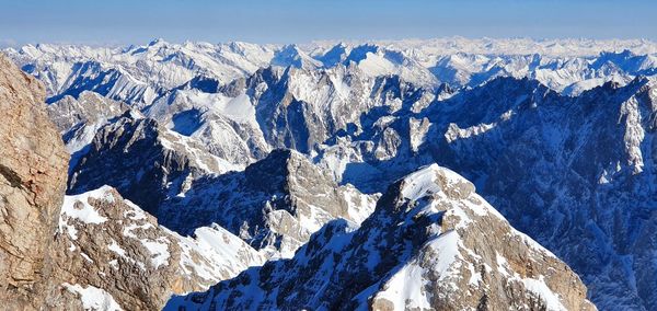 Scenic view of snowcapped mountains against sky