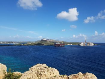 Scenic view of sea against blue sky