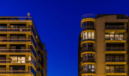 Low angle view of building against blue sky