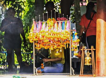 Group of people in market stall