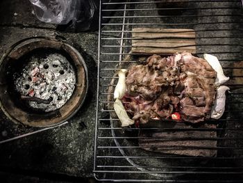 Close-up of meat on barbecue grill