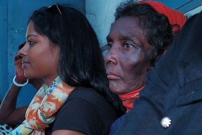 Side view of young woman and a old woman looking away