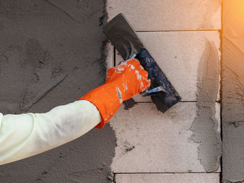 Person working on wall