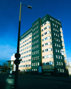 Low angle view of building against blue sky