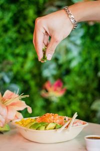 Close-up of hand preparing food