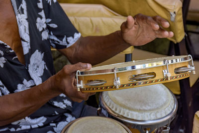 Musician playing tambourine in pelourinho in salvador in bahia during a samba performance