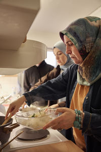 Family preparing dinner together at home