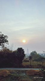 Scenic view of field against sky during sunset