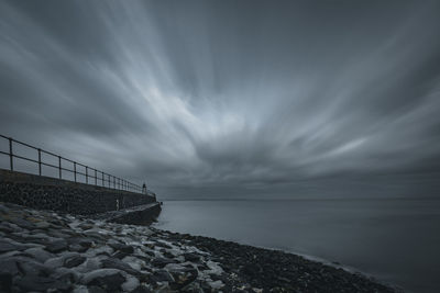 Bridge over sea against sky