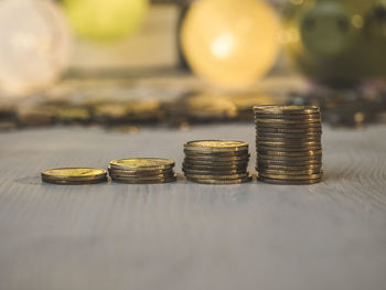 Close-up of coins on table