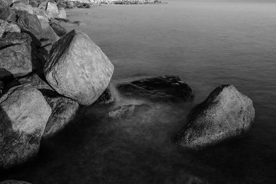 High angle view of rocks on sea shore