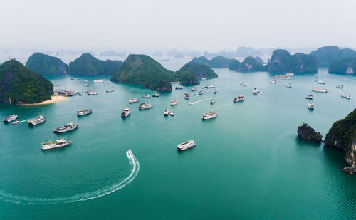 High angle view of boats in sea against sky