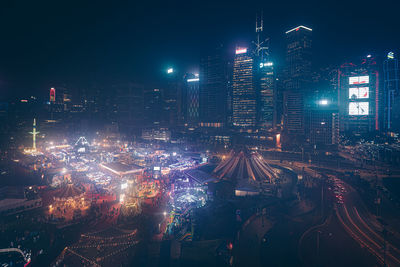 High angle view of illuminated buildings in city at night