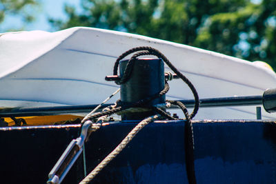 Close-up of rusty boat moored in water