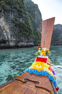 Scenic view of rock formation in sea against sky