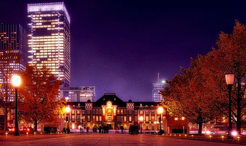 Illuminated buildings in city at night