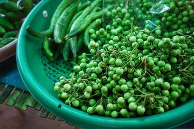 High angle view of carissa carandas for sale at market stall