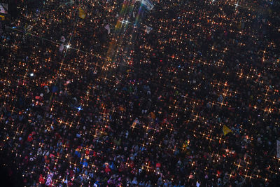 Aerial view of illuminated city at night