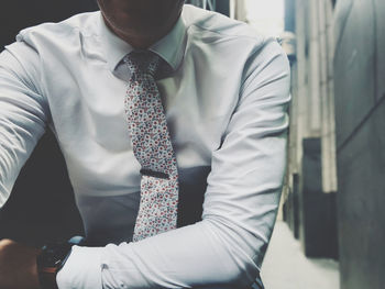 Midsection of man wearing mask