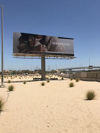 Built structure on sand against clear sky during winter