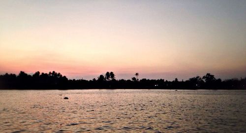 Scenic view of sea at sunset