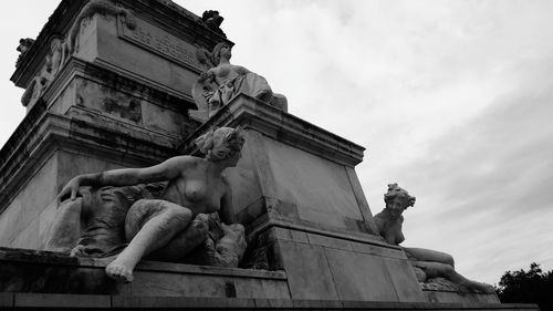 Low angle view of statue against building