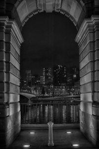 Arch in city against sky
