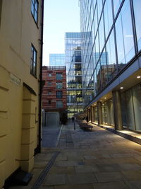 Buildings in city against clear sky