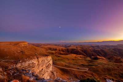 Scenic view of mountains against sky during sunset