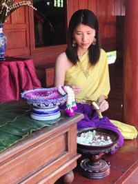 Woman making garlands