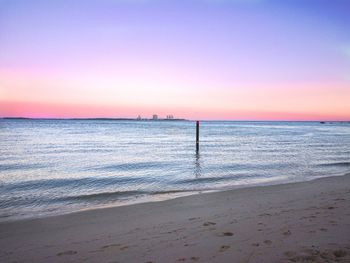 Scenic view of sea against clear sky during sunset