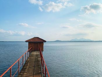 Pier over sea against sky