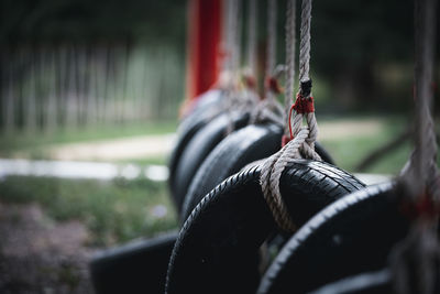 Close-up of rope tied on swing at park