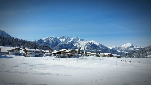 Scenic view of snow covered mountains against sky