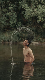 Rear view of woman in water