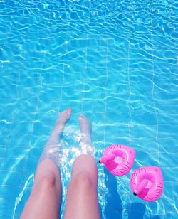 Low section of woman in swimming pool