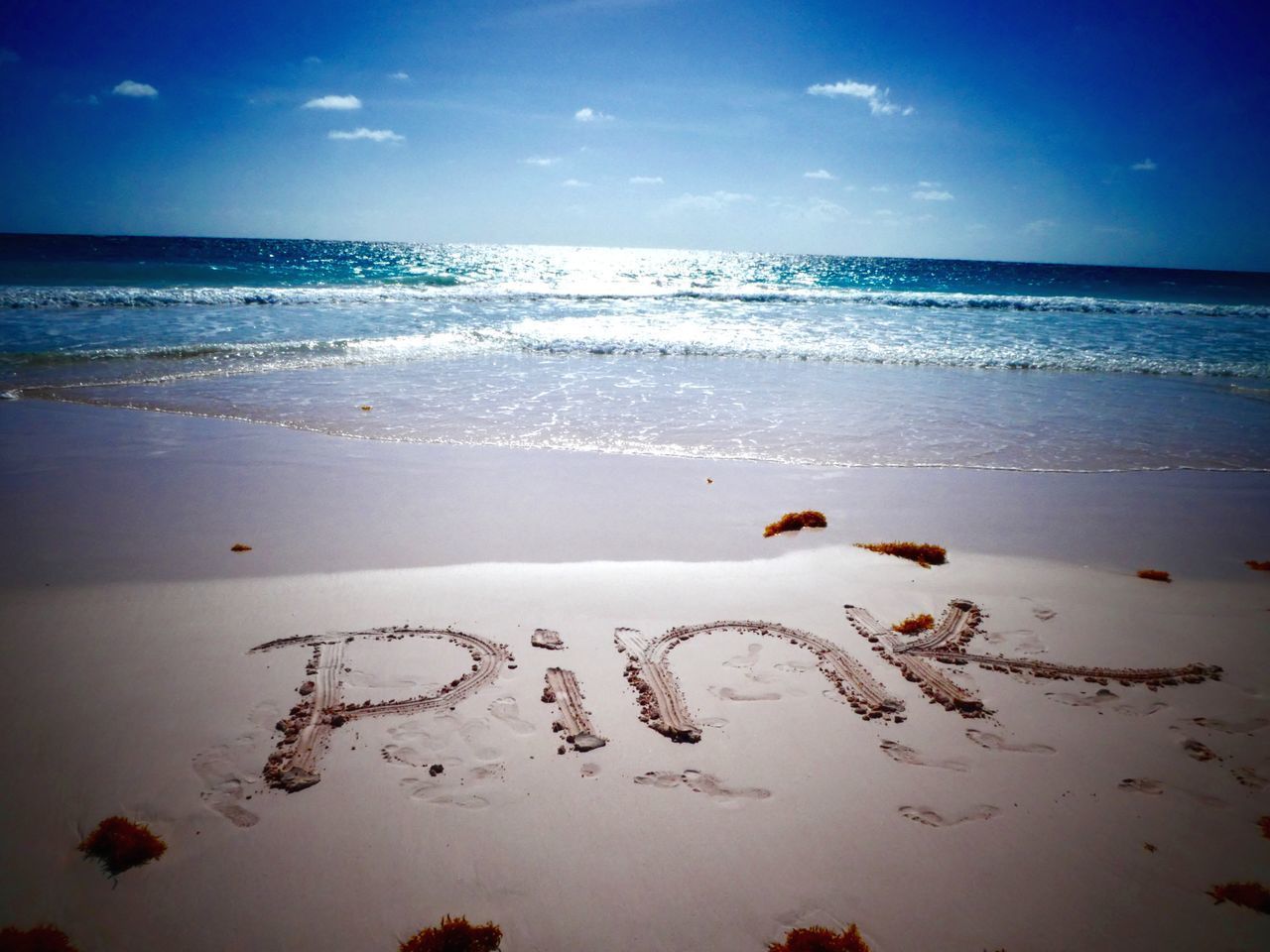 TEXT ON SAND AT BEACH