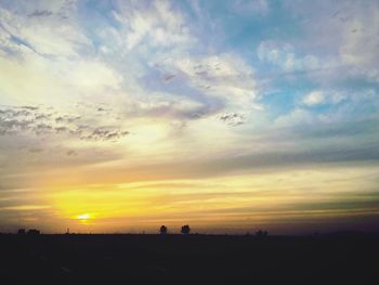 Scenic view of landscape at sunset