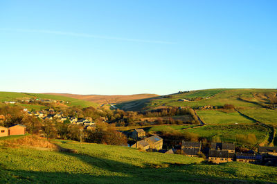 Scenic view of landscape against clear blue sky