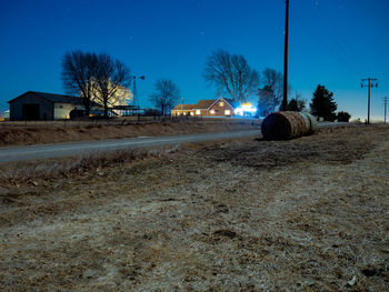 Surface level of road against clear sky at night