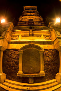 Low angle view of illuminated historical building