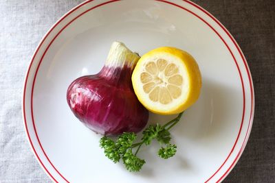 High angle view of fruits in plate on table