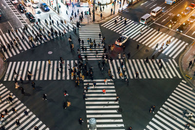 High angle view of people walking on city street