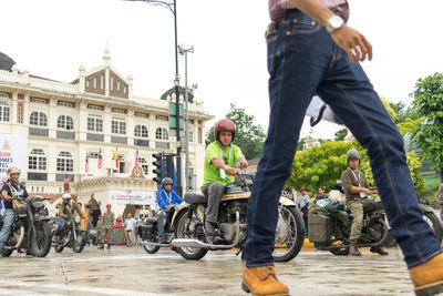 People riding bicycle on city street