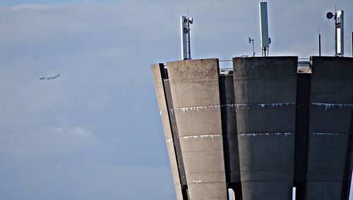 Low angle view of factory against sky