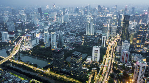 High angle view of illuminated buildings in city