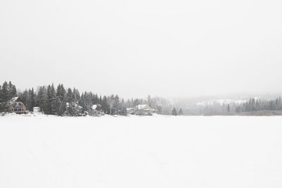 Snow covered land against sky