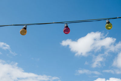 Low angle view of hanging against sky